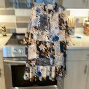 Loose fitting 100 percent silk beautiful navy rust and beige print ruffle hem